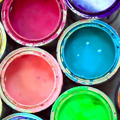 An image of a set of open paint cans displaying vibrant colors.